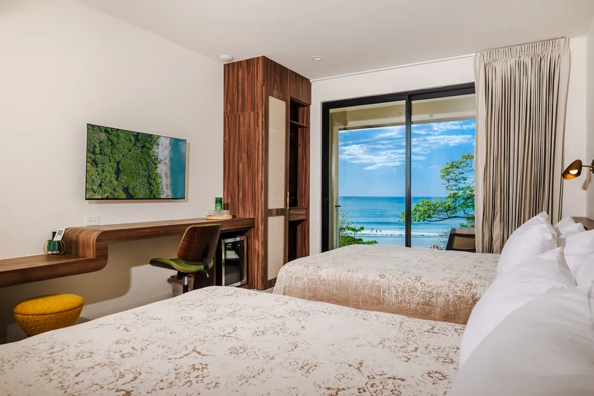 Oceanfront Balcony Suite with desk and ocean view