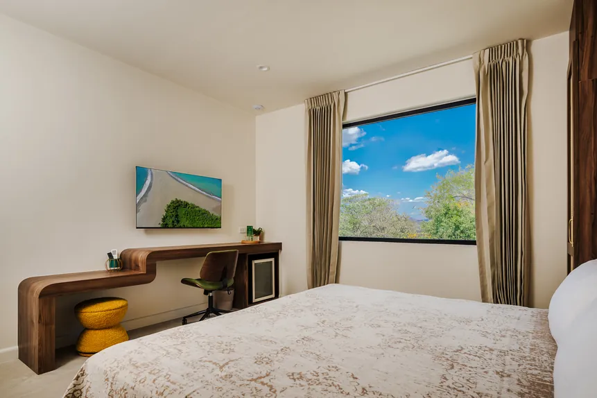 Oceanview Suite with king bed, desk and window view